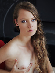 Erotic picture of Milana K strips off her sexy red nighty