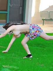 Erotic picture of Leila does cartwheels topless outside