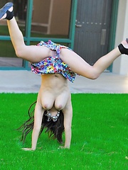 Erotic picture of Leila does cartwheels topless outside