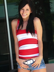 Erotic picture of Catie Minx issues an extreme camel toe alert in tight jean shorts