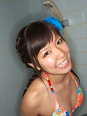 Erotic picture of Sweet Ayana Tanigaki smiles and poses at the kitchen with banana