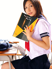 Erotic picture of Kaori Ishii Asian is naughty and shows legs under uniform skirt