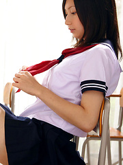 Erotic picture of Kaori Ishii Asian is naughty and shows legs under uniform skirt