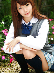 Erotic picture of Manami Sato Asian in short uniform skirt spends time in the park