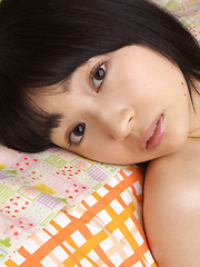 Erotic picture of Kotone Moriyama Asian rubs her vagina in bath suit of chair edge