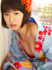 Erotic picture of Rio Matsushita Asian shows sexy legs under geisha dress outdoor