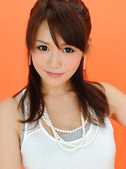 Erotic picture of Yumi Asian is such cute and playful honey in white top and skirt