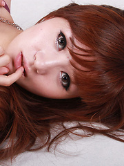 Erotic picture of Sandy Asian in red dress is so leering touching her sexy lips