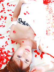 Erotic picture of Saki Yamaguchi Asian spoils leering body in water with petals