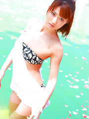 Erotic picture of Saki Yamaguchi Asian spoils leering body in water with petals