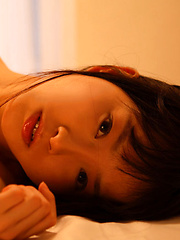 Erotic picture of Kana Moriyama Asian takes uniform off piece by piece at window