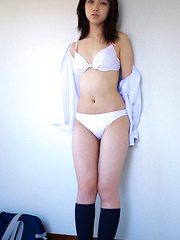 Erotic picture of Azusa Togashi Asian undresses uniform to show behind in panty