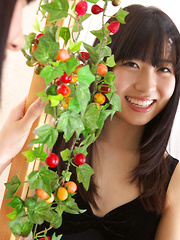 Erotic picture of Hijiri Sachi Asian shows sexy legs under dress and plays a lot