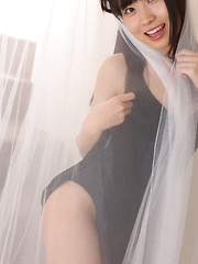 Erotic picture of Hijiri Sachi Asian shows sexy legs under dress and plays a lot