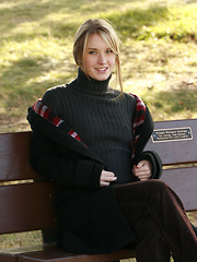 Erotic picture of Preppy schoolgirl shows off her bush in the park
