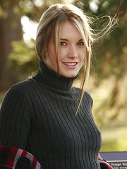 Erotic picture of Preppy schoolgirl shows off her bush in the park