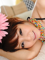 Erotic picture of Hot dark haired Japanese babe shows her body