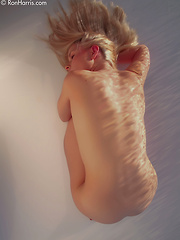 Erotic picture of Goddess Kara Duhe on the floor seducing with her tight curves