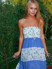 Erotic picture of Beautifully tanned Sarika A plays around in her sun dress before taking it off to reveal her sexy bits.