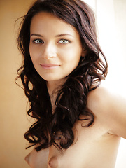 Erotic picture of Finely-chiseled facial features and an elegant feminine allure, Ardelia A basks in the morning light flooding through her bedroom windows, tracing her body's majestic curves.