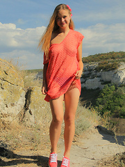 Erotic picture of Gorgeous teen embraces the summer with stripping off her clothes in front of beautiful scenery where she can feel free.