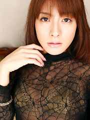 Erotic picture of Rika Kawamura Asian shows cunt in spider lace crotchless outfit