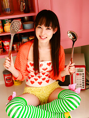 Erotic picture of Rina Akiyama Asian in long colorful socks enjoys some sweets